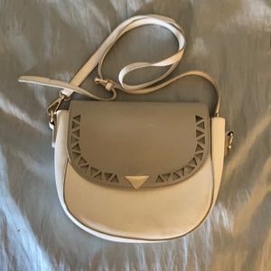 Grey and white shoulder purse . Snap closure .